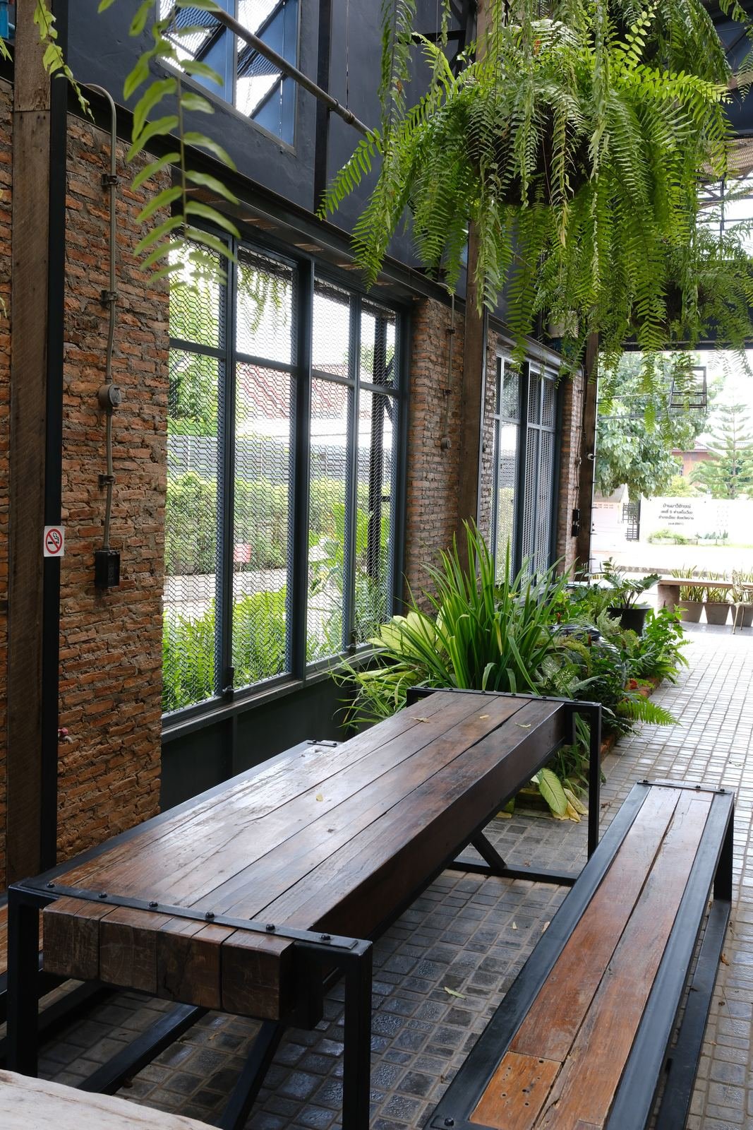 Long timber bench beside the garden windows
